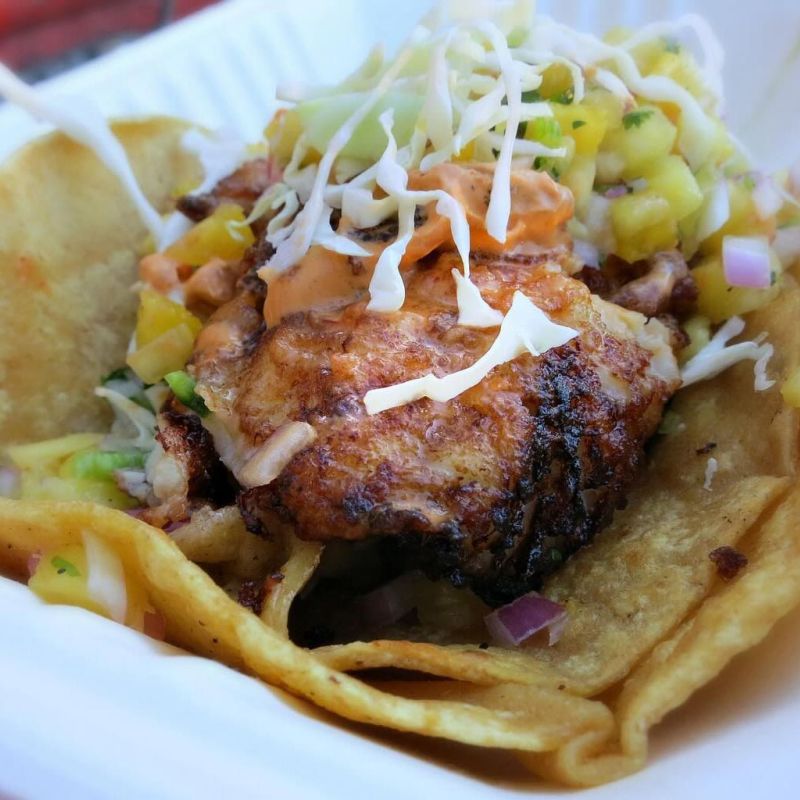 Baja Fish Taco with cabbage and Sam's special sauce wrapped in corn tortillas