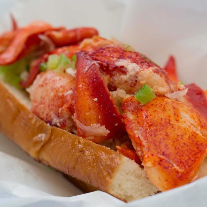 lobster roll sandwich with Maine lobster lightly tossed in warm butter on toasted bun from Sam's ChowderMobile