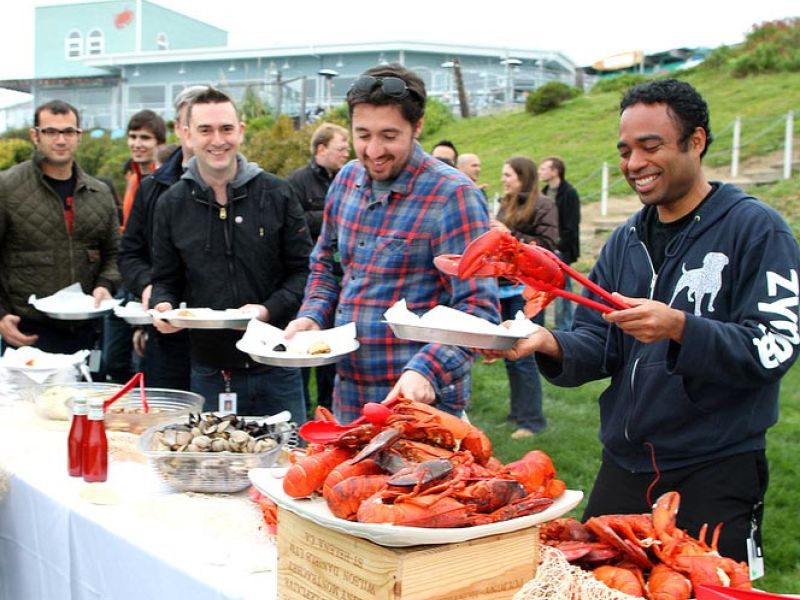 employees enjoying corporate event lobster clambake luncheon catered by Sam's